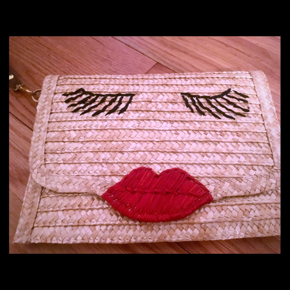 Kissy lips woven envelope clutch